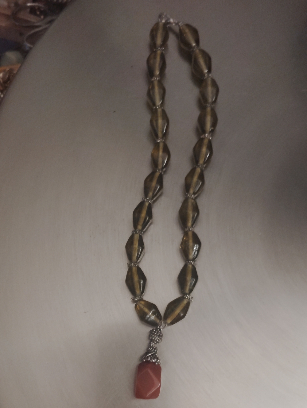 Elegant Brown Beaded Necklace with Coral Pendant